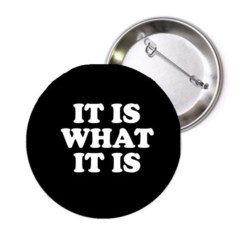 Black pinback button with white text โIt is what it isโ