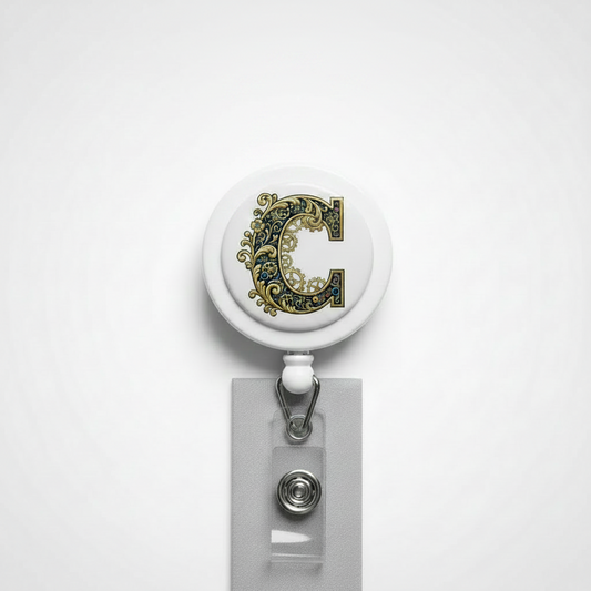 Retractable badge reel with round letter C top and metal badge holder