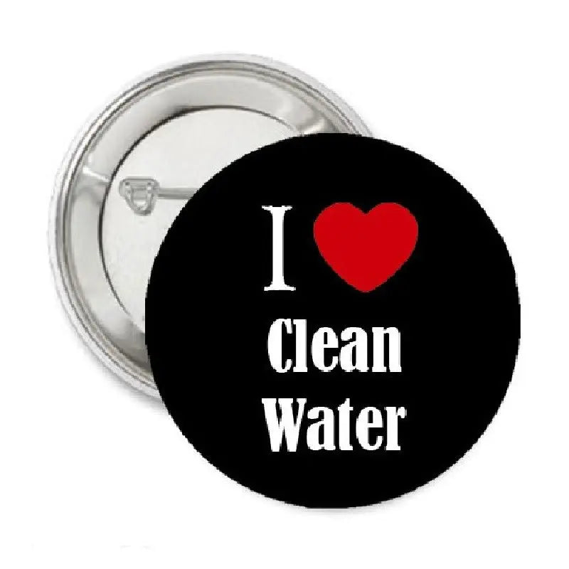 1.25-inch pinback button, round black with white “I” and “Clean Water” text, red heart