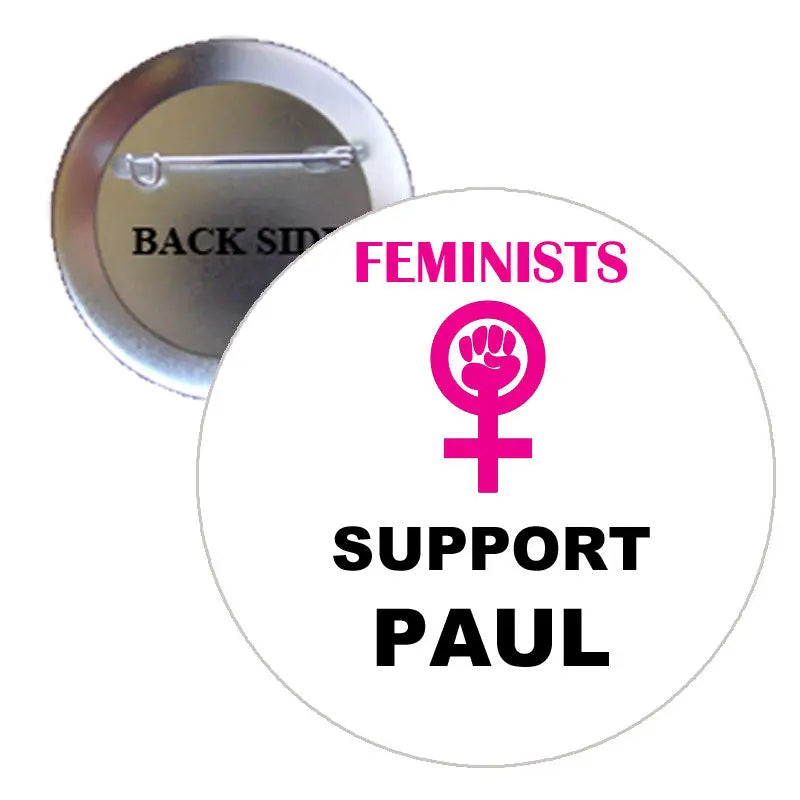Round pinback button with “Feminists Support Paul” text and feminist symbol