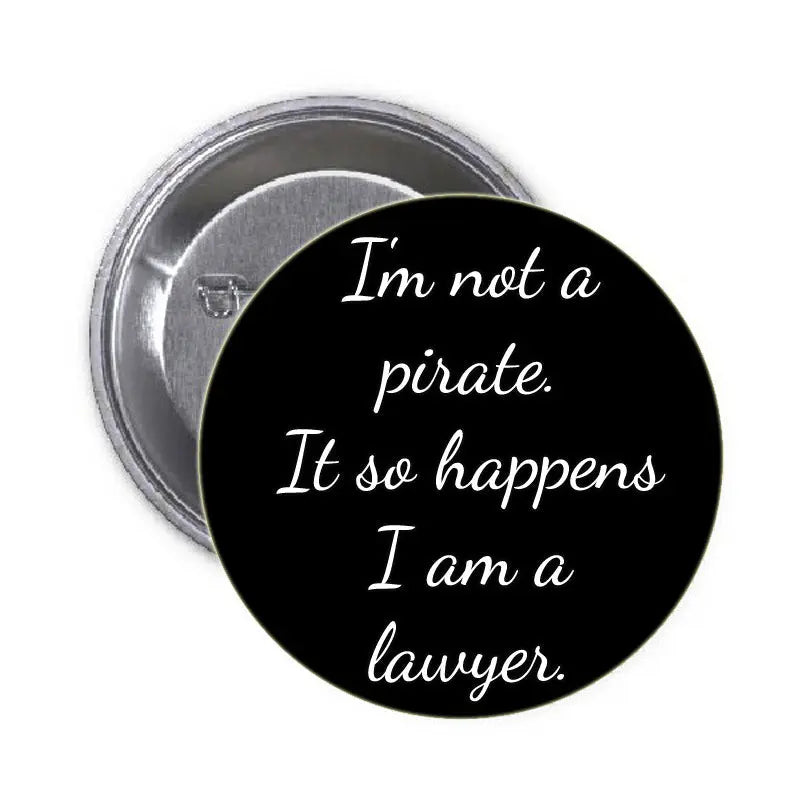 1.25-inch black pinback button with white script quote: 'I'm not a pirate...'
