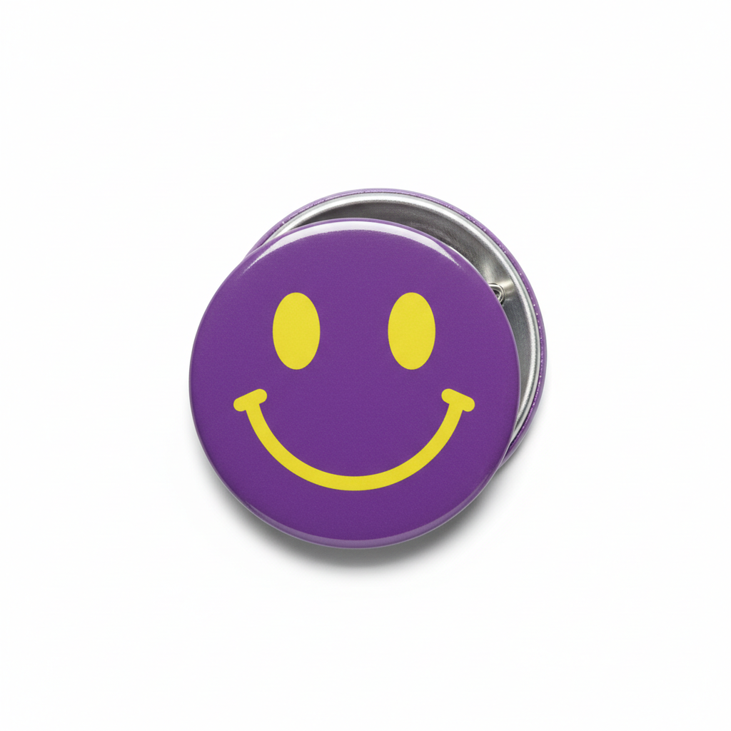 2.25-inch purple smiley face pinback button with yellow grin and silver backing