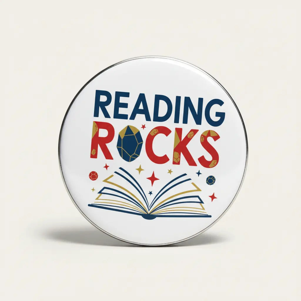 Reading Rocks 2.25-inch pinback button: circular metal with “READING ROCKS” and book graphic