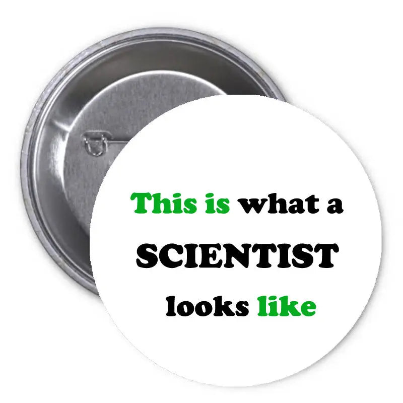 1.25-inch pinback button: white with green/black text 'This is what a SCIENTIST looks like'