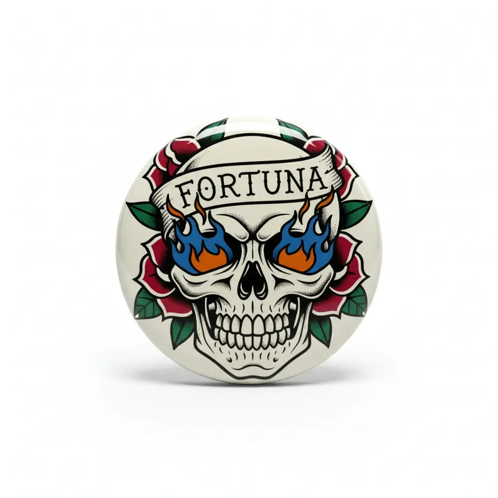Tattoo-style skull pinback button with FORTUNA text, flames, and green rose border