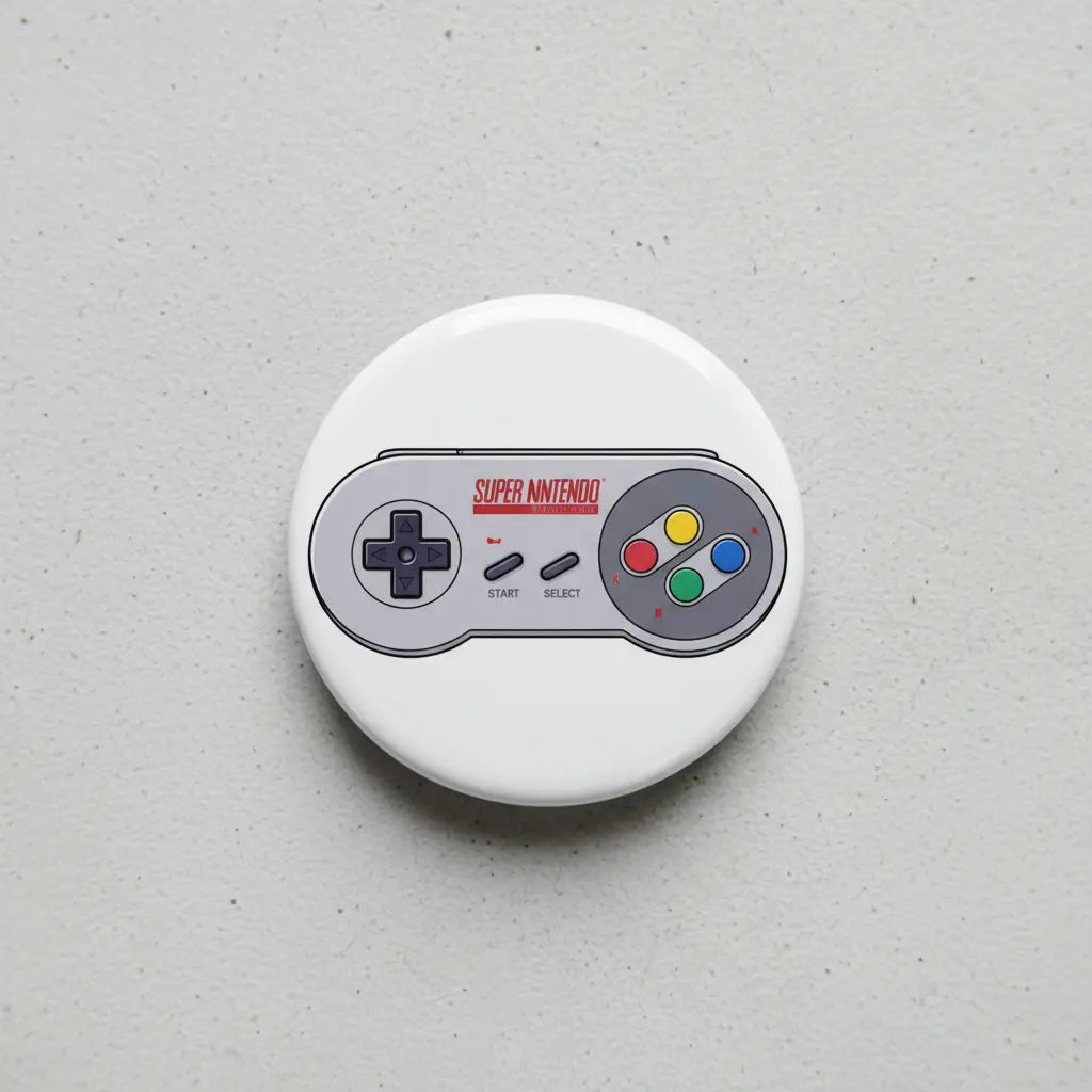Super Nintendo controller pinback button, round white with controller graphic and colored buttons