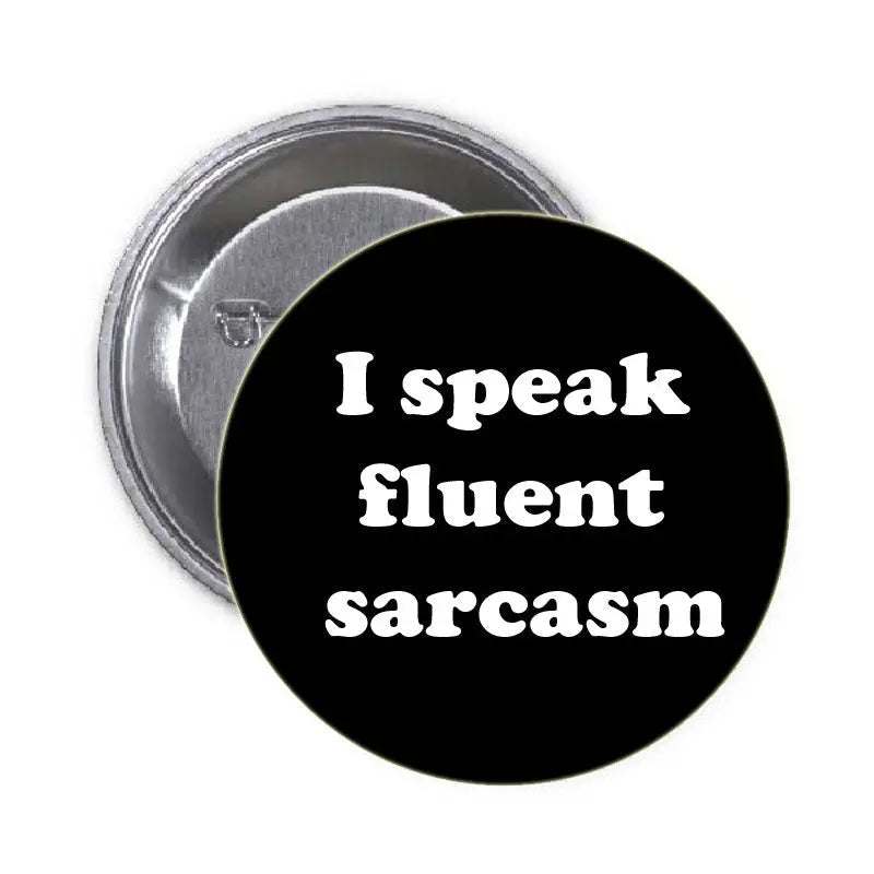 Black round pinback button reading "I speak fluent sarcasm"