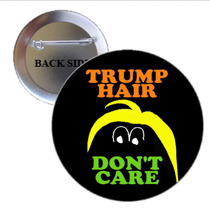 1.25-inch round pinback button with black background, TRUMP HAIR and DON'T CARE text