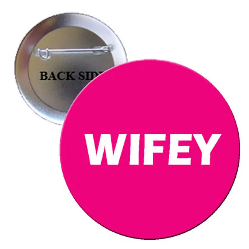 1.25-inch round pink pinback button with white "WIFEY" text and metal clasp back