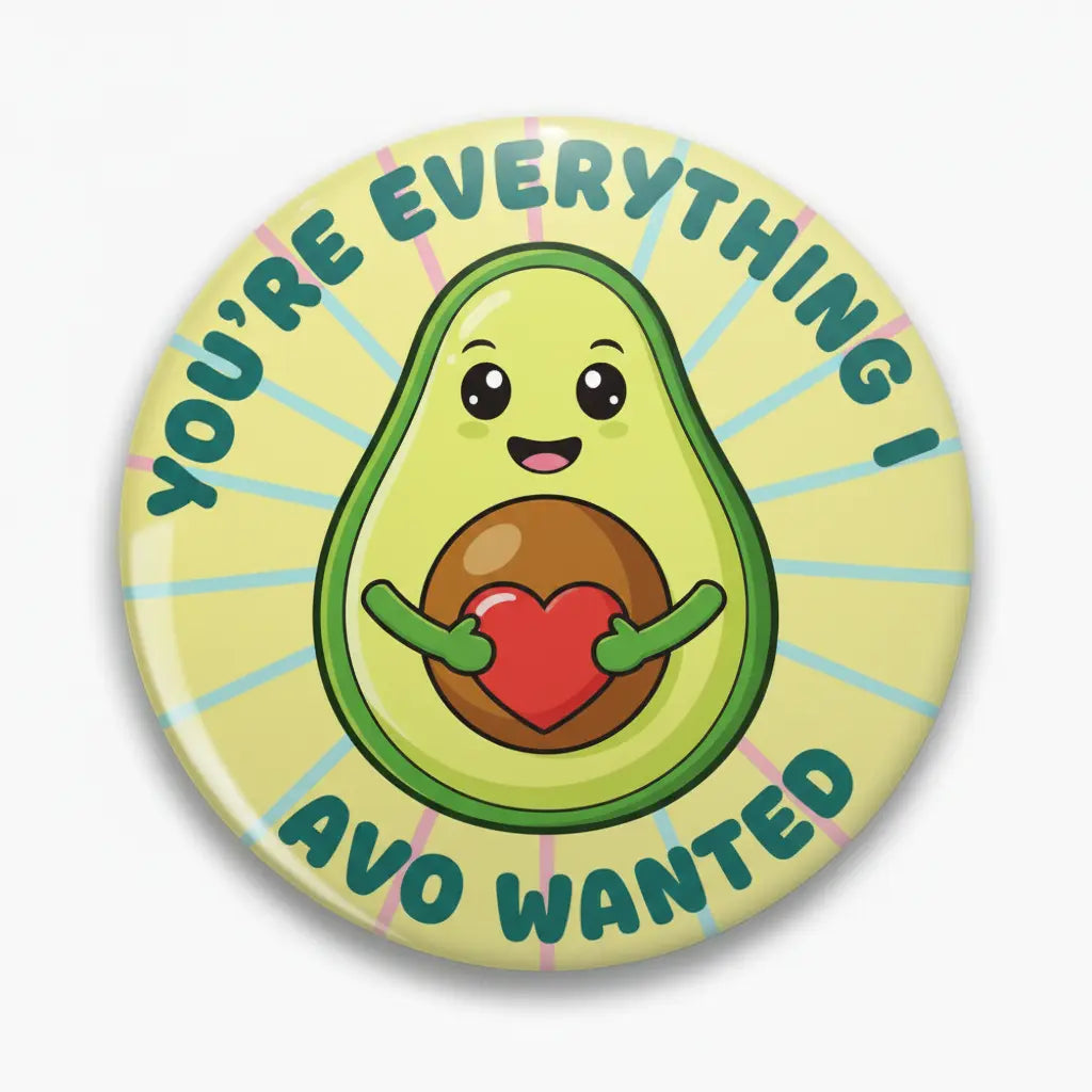 2.25-inch pinback button: cartoon avocado with "YOU'RE EVERYTHING, AVO WANTED" text