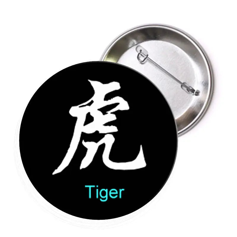 Round tiger art pinback badge, black face with white character and blue 'Tiger', metal pin back