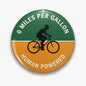 Green/orange bike pinback button with cyclist silhouette and '0 MILES PER GALLON'