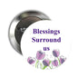 Tulip-themed pinback brooch with “Blessings Surround Us” text, purple floral artwork