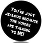 Round black pin-back badge with white text: You're just jealous