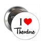 Round metal pinback button with I Love Theodore text and red heart
