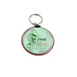 Round green friendship quote keychain holder with red rim and metal key ring