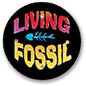 2.25-inch pinback button with black background and colorful “LIVING FOSSIL” text