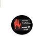 Round pinback brooch: black with red hand, 'Human Trafficking' and 'Make It Stop'.