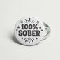 100% Sober pinback button with starburst and black text on round silver badge