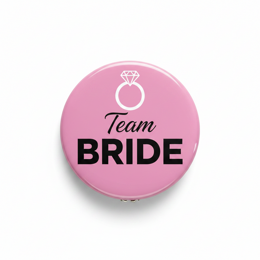 Pink pinback button with 'Team BRIDE' text and ring icon