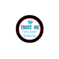 Round enamel-style laser technician pin, black border, blue Trust Me text