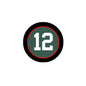 2.25-inch pinback button with black border, red rim, and large number 12