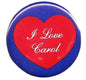Heart-shaped pinback button with red “I Love Carol” text on blue border