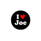 Round black pinback badge with 'I ♥ Joe' text and red heart
