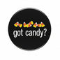 Black enamel badge pin with red border and “dot candy?” text, candy-striped accents