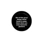 2.25-inch black pinback badge with white quote text