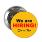 2.25-inch round pinback button, yellow-orange with 'We are HIRING!' and 'Join our Team'.
