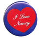 Pinback button with red heart reading 'I Love Nancy' on blue circular backing