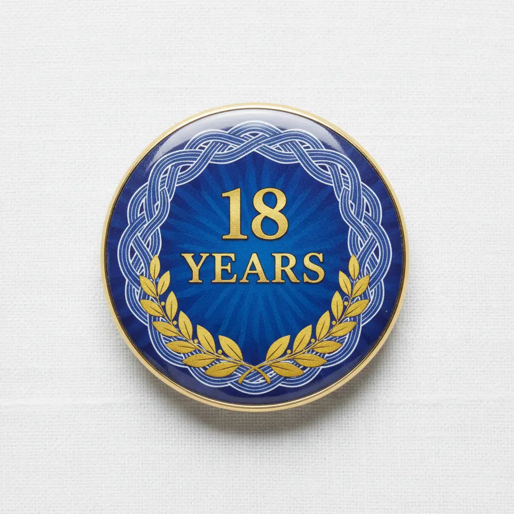 18 Years certificate pinback badge, blue round design with gold trim and laurel wreath
