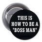 Black pinback button with text: THIS IS HOW TO BE A "BOSS MAN"