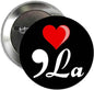2.25-inch pinback button with black face, red heart, and 'Kamala' stylized text