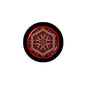 Round mini button badge with black rim and psychedelic red-blue-yellow tie-dye pattern