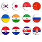 Set of 1.25-inch circular pinback flag badges with colorful country designs