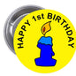 2.25-inch pinback button, yellow with blue silhouette and candle, 'Happy 1st Birthday'.