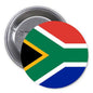South Africa flag pinback button, circular badge with green, gold, white, and red