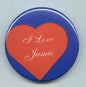 Round pinback button with red heart reading I Love Jamie on blue border
