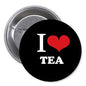 Round pinback button, black with white “I” and “TEA” and red heart