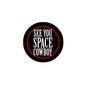 Round pinback badge with black border and red outline, featuring “SEE YOU SPACE COWBOY”