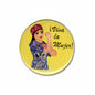 Round pinback button with illustrated woman and text “i Viva la Mujer!”