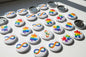 Set of autism awareness pinback buttons with infinity and puzzle icons, silver backing