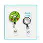 Felt retractable badge reel with green circular love design and clear badge clip