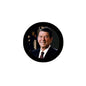Circular pinback badge with Ronald Reagan portrait in suit and star-and-flag backdrop