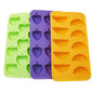 Ice tray with grape, apple, and orange molds; green, purple, yellow silicone