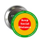 Round pinback button with “Keep Social Distance” text in yellow, red, and green rings
