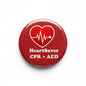 Red circular CPR+AED pinback brooch with white heart/ECG and HeartSaver text