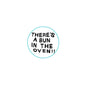 Round pinback button with "THERE'S A BUN IN THE OVEN!!" text